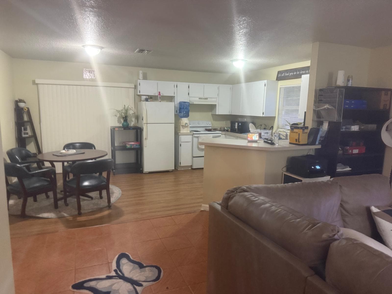 Open floor plan with dining area, kitchen, and seating at ADOL FOSTER HOME in Tampa.
